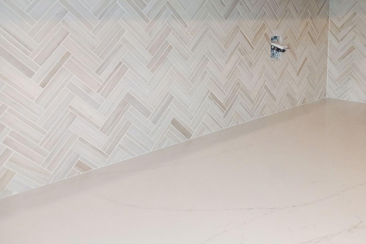 Kitchen remodel with herringbone backsplash